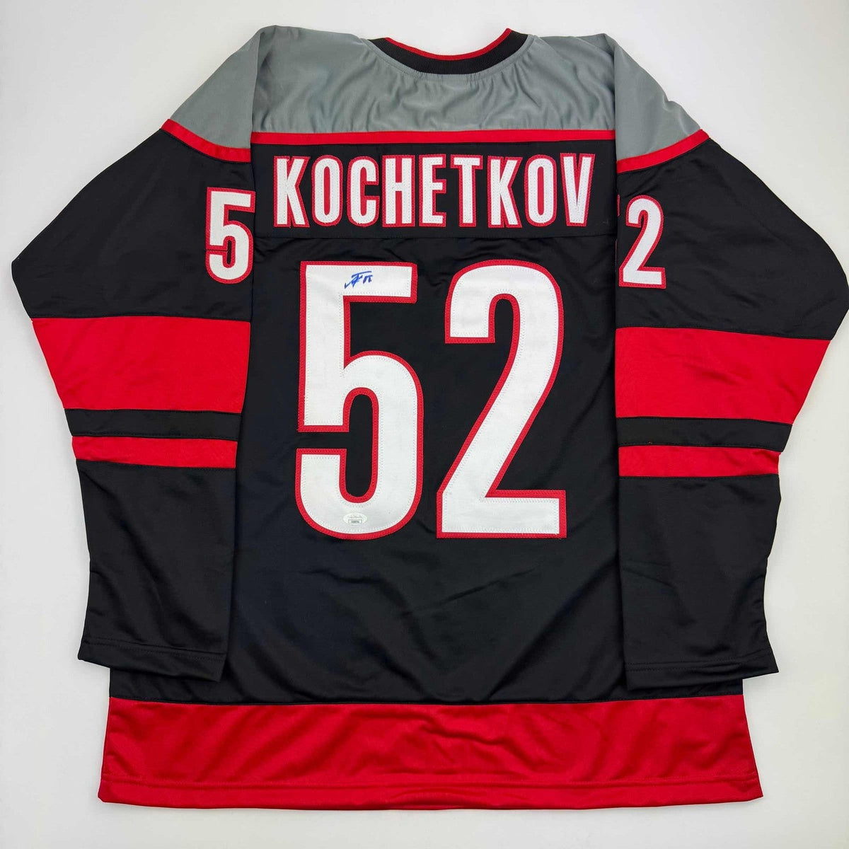 Autographed/Signed Pyotr Kochetkov Carolina Black Hockey Jersey JSA COA product image 1, provided for visual reference and