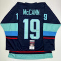Autographed/Signed Jared McCann Seattle Blue Hockey Jersey JSA COA product image 1, provided for visual reference and