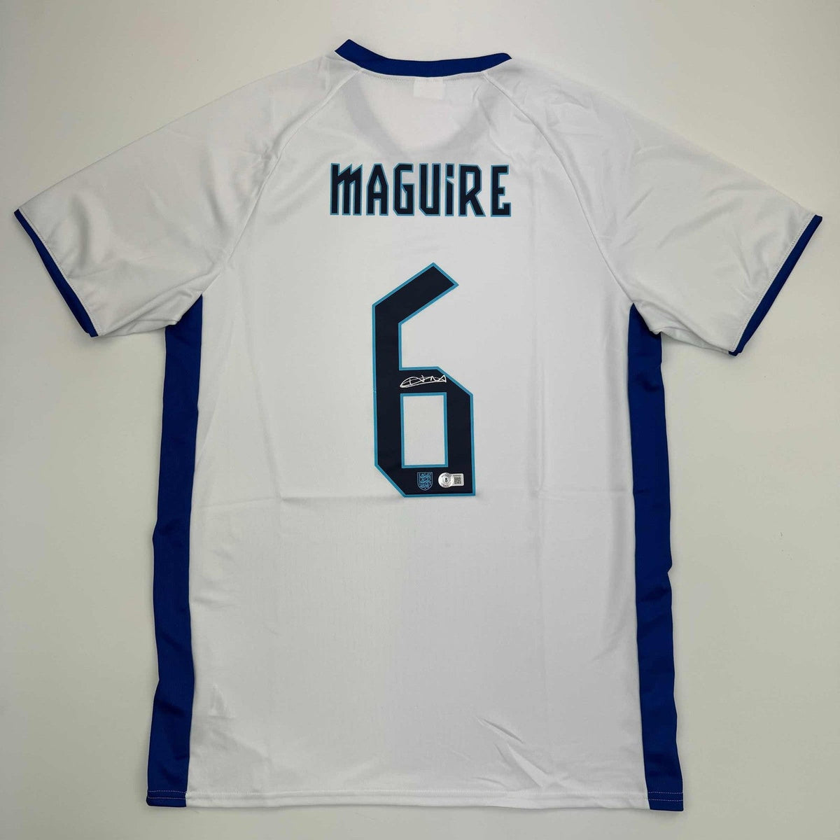 Autographed/Signed Harry Maguire England White Jersey Beckett BAS COA product image 1, provided for visual reference and